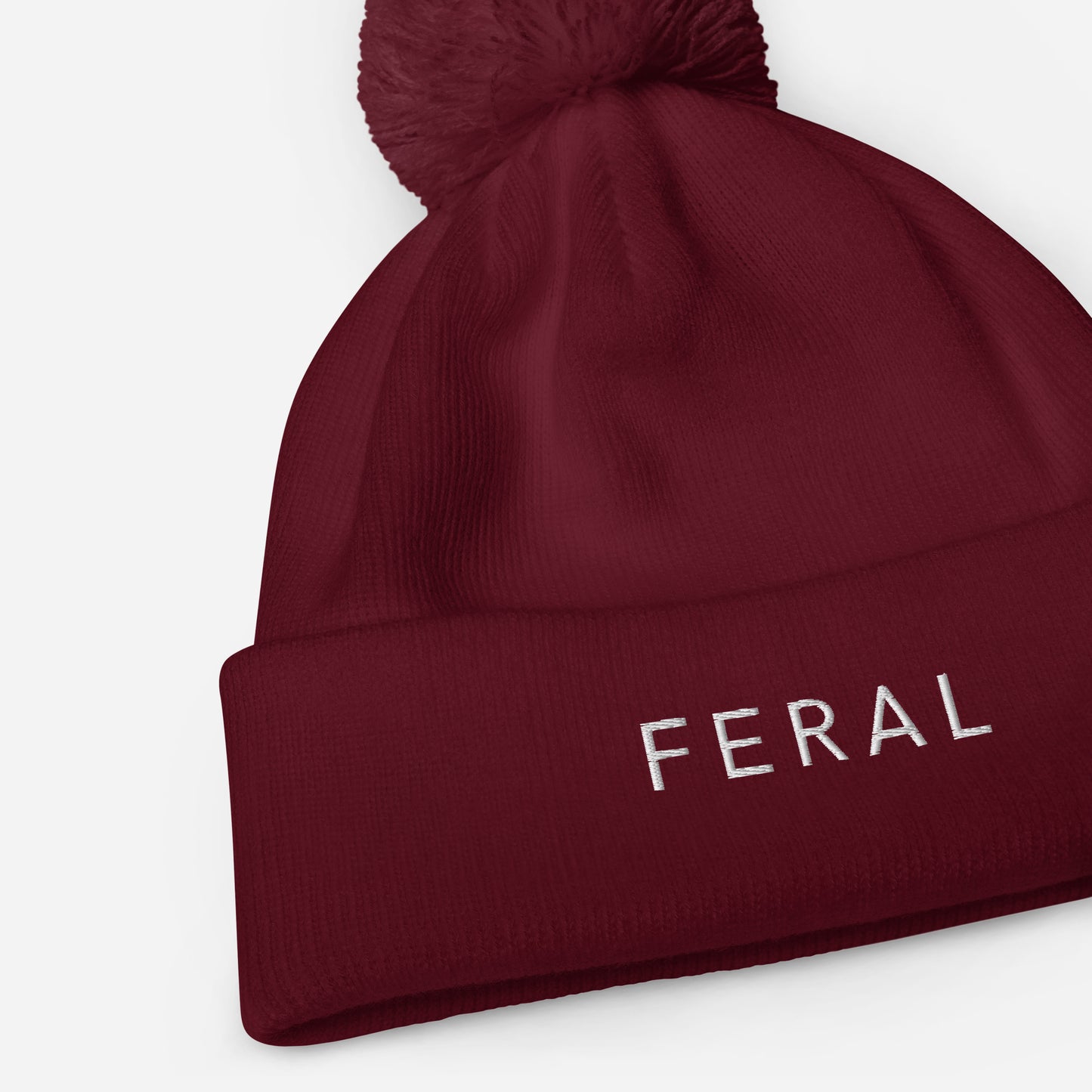 Feral Pom pom beanie
